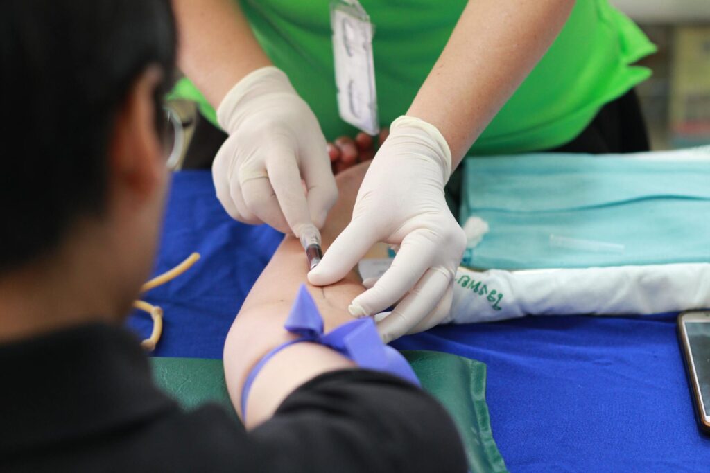 nurse giving injection to a patient, first-aid medical help at Blue Mountain Medical Center